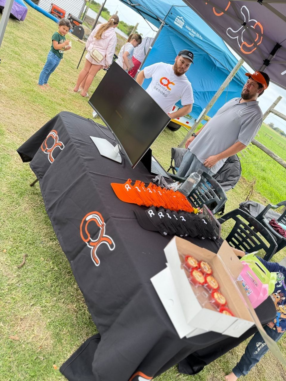 ChainEX visors, caps and treats on the merch table
